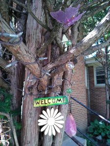Welcome sign in a tree
