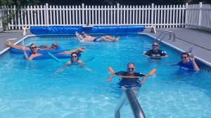 7 people in a swimming pool