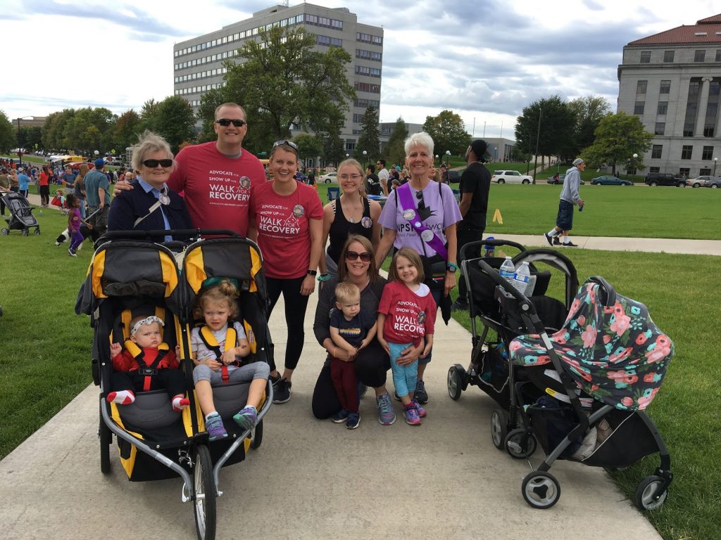 7 adults and 3 children standing in a group on Capitol grounds